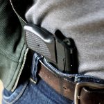 Suspect enters court with gun threatens to shoot witness